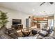 Comfortable living room with a view into the kitchen, creating a warm and inviting atmosphere at 8808 Macapa Dr, Kissimmee, FL 34747