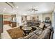 Open concept living area featuring a kitchen, dining area, and large sofa at 8808 Macapa Dr, Kissimmee, FL 34747