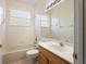 Bathroom featuring a vanity, a mirror, a bathtub and a window at 9723 Pecky Cypress Way, Orlando, FL 32836