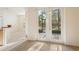Bedroom with neutral carpet and sliding glass doors leading to an outdoor patio at 9723 Pecky Cypress Way, Orlando, FL 32836