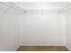 Walk-in closet space featuring carpeted floors and wire shelving for organized storage at 9723 Pecky Cypress Way, Orlando, FL 32836