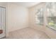 Bright dining area with tile flooring and large windows, ideal for enjoying meals with natural light at 9723 Pecky Cypress Way, Orlando, FL 32836