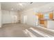 Open-concept living room, kitchen with archways and abundant natural light at 9723 Pecky Cypress Way, Orlando, FL 32836