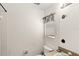 Bathroom featuring tile floors, a window, and modern toilet at 9919 Cypress Knee Cir, Orlando, FL 32825