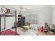 Bedroom featuring tile floors, a bunk bed, and dresser with a TV at 9919 Cypress Knee Cir, Orlando, FL 32825