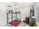 Bedroom featuring tile floors, a bunk bed, and dresser with a TV at 9919 Cypress Knee Cir, Orlando, FL 32825