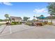 Inviting community pool area with palm trees, ample parking, and comfortable lounge areas at 9919 Cypress Knee Cir, Orlando, FL 32825