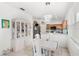 Dining room with hutch, dining table and view into the kitchen at 9919 Cypress Knee Cir, Orlando, FL 32825