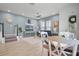 Bright living room with blue accent wall, staircase, and dining area, showcasing an open floor plan at 1010 Lychee Ct, Lake Mary, FL 32746