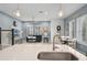 Open-concept living room with breakfast nook showcases wood flooring, and natural light at 1010 Lychee Ct, Lake Mary, FL 32746