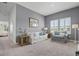 This living room is bright and airy, with plenty of space to relax and entertain, and stylish plantation shutters at 1010 Lychee Ct, Lake Mary, FL 32746