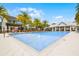 Resort-style community pool with lounge chairs and shaded pergola offers relaxation and recreation at 1010 Lychee Ct, Lake Mary, FL 32746