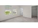 Bright bedroom featuring carpet floors, an open door and big windows with neighborhood views at 10133 Merrymeeting Bay Dr, Winter Garden, FL 34787