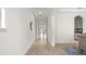 Hallway featuring tile floors and white walls leading into other rooms at 10133 Merrymeeting Bay Dr, Winter Garden, FL 34787