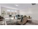 Comfortable living area with natural light and a cozy seating arrangement on neutral carpeting at 10133 Merrymeeting Bay Dr, Winter Garden, FL 34787