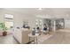 Bright living room seamlessly connects to the kitchen, creating an open and inviting space at 10133 Merrymeeting Bay Dr, Winter Garden, FL 34787