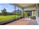 Screened patio featuring a brick floor with a view of the green back yard at 10133 Merrymeeting Bay Dr, Winter Garden, FL 34787