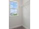 Bright walk-in closet with a window for natural light and white wire shelving for optimal storage solutions at 10133 Merrymeeting Bay Dr, Winter Garden, FL 34787