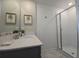 Bathroom featuring a vanity with a stainless steel faucet and a glass door shower at 1036 Leader Street, Davenport, FL 33896