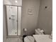 Bathroom showcasing a glass door shower and toilet at 1036 Leader Street, Davenport, FL 33896