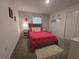 Comfortable bedroom with a heart-themed wall and pink accents at 1036 Leader Street, Davenport, FL 33896