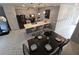 Aerial view of the modern kitchen and dining area with stainless steel appliances at 1036 Leader Street, Davenport, FL 33896