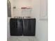 Laundry room with sleek black washer and dryer at 1036 Leader Street, Davenport, FL 33896