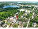 Scenic aerial view of a lakeside community with lush trees and well-maintained homes at 1040 Hamlet Dr, Maitland, FL 32751