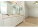 Bathroom with double sink vanity, large mirrors, and tile flooring at 1040 Hamlet Dr, Maitland, FL 32751