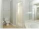 Bathroom featuring a toilet, shower, and bathtub with tile surround at 1040 Hamlet Dr, Maitland, FL 32751