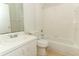 White bathroom featuring a vanity, toilet, and bathtub-shower combo at 1040 Hamlet Dr, Maitland, FL 32751