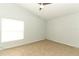 Bright bedroom with large window, neutral walls, and a ceiling fan at 1040 Hamlet Dr, Maitland, FL 32751