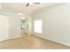 Spacious bedroom featuring tile flooring, a ceiling fan, and a bathroom view at 1040 Hamlet Dr, Maitland, FL 32751