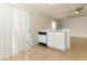 Well-equipped kitchen with white cabinets and modern appliances with outdoor access at 1040 Hamlet Dr, Maitland, FL 32751