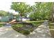 Community playground with bench and walking path near neighborhood at 1040 Hamlet Dr, Maitland, FL 32751