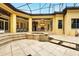 Beautiful backyard with a water feature, outdoor kitchen, and covered dining area at 11055 Ullswater Ln, Windermere, FL 34786