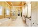 Spa-like bathroom offers a large soaking tub and an oversized walk-in shower at 11055 Ullswater Ln, Windermere, FL 34786