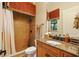 Tiled bathroom with decorative shower curtain, granite vanity, and natural light at 11055 Ullswater Ln, Windermere, FL 34786