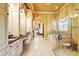 Luxurious bathroom features a glass shower, soaking tub, and double vanity with great natural light at 11055 Ullswater Ln, Windermere, FL 34786