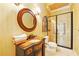 Charming bathroom featuring a custom vanity and glass enclosed shower at 11055 Ullswater Ln, Windermere, FL 34786