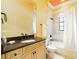 Well-lit bathroom featuring a combined shower and tub, tile flooring, and granite countertop vanity at 11055 Ullswater Ln, Windermere, FL 34786