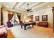 Entertaining game room featuring a pool table, seating, and a wet bar at 11055 Ullswater Ln, Windermere, FL 34786