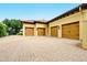 This home boasts a spacious four-car garage with decorative carriage doors, offering ample parking and storage at 11055 Ullswater Ln, Windermere, FL 34786