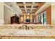 Open concept kitchen with granite countertops that overlooks the living area at 11055 Ullswater Ln, Windermere, FL 34786