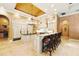 Gourmet kitchen with custom cabinets, granite countertops, a center island, and modern appliances at 11055 Ullswater Ln, Windermere, FL 34786