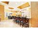 Open-concept kitchen with granite island, counter seating, and adjacent dining area, ideal for entertaining at 11055 Ullswater Ln, Windermere, FL 34786