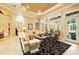 Spacious living room with travertine floors, decorative ceiling, and natural light at 11055 Ullswater Ln, Windermere, FL 34786