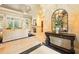 Elegant living room featuring travertine floors, fireplace, and large windows at 11055 Ullswater Ln, Windermere, FL 34786