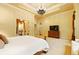 Serene primary bedroom suite features a decorative ceiling and a sitting area at 11055 Ullswater Ln, Windermere, FL 34786