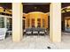 Elegant outdoor dining area featuring neutral tile flooring and comfortable seating at 11055 Ullswater Ln, Windermere, FL 34786